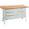 Workbench with wooden top, drawers and cabinet doors. Gray metal frame, silver handles.
