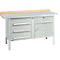 Workbench with gray metal surface, wooden top, and drawers. Drawer handles and legs are silver.