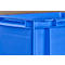 Corner of a blue plastic box, detail shot with visible connections and recesses.