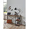 Bureau avec lampe et ordinateur portable, aménagé avec style. Fenêtre et photos en arrière-plan.