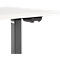 Détail d'un bureau réglable en hauteur. Commandes noires sous un plateau de table blanc.