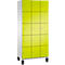 Een kast met 12 vakken, geel geschilderd, voor een witte zijwand, met zwarte voeten.