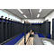 Locker room with lockers, benches and blue floor covering.