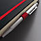 Gros plan d'un carnet avec une bande élastique rouge et un stylo. Le stylo a une poignée rouge et une pointe argentée.