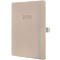 Cahier beige, rainures verticales, élastique. Le devant indique "2026" en relief.