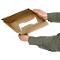 Hands holding an open, square cardboard box.