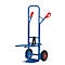 Blue hand truck with red handles and tires. The cart stands in front of a white background.