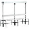 Grey bench with backrest and upper shelf. Black metal frame. The design is functional and modern.