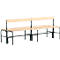 Long bench made of wooden slats with dark metal legs and backrest.