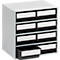 Gray rectangular cabinet with nine drawers, one is open. Each drawer has a white label and a black frame.