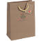 Brown paper bag with Christmas tree design and tag with apple. Text: "Love Christmas".