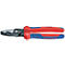 Pince coupante en forme de ciseaux avec des poignées rouges et bleues, en métal foncé. Inscription : KNIPEX.