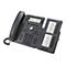 Un téléphone Cisco gris avec un module d'extension, des boutons et des écrans. Le téléphone est posé sur un fond blanc.