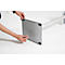 Person assembling a silver pillar. A screw is being attached to the base with an Allen key.