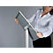 Woman holding a white and gray presentation board. She wears a white shirt and black pants.