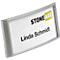 Silver name badge with a white background. It reads: "STONE AGE" and "Linda Schmidt."