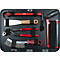 Boîte à outils avec outils rouges et noirs : clé à molette, tournevis, spatule, etc.