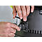 Close-up of hands plugging a plug into a socket.