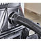 Close-up of a black vacuum cleaner hose attached to a grey device.