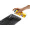 A hand sprays cleaning foam from a yellow can onto a black computer keyboard.