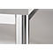 Corner of a white table with a shiny metal leg support.