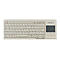 Beige Tastatur mit deutschem QWERTZ-Layout und integriertem Touchpad auf der rechten Seite.
