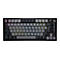 Schwarze, kompakte Corsair Gaming-Tastatur mit RGB-Beleuchtung und Lautstärkedrehregler vor weißem Hintergrund.