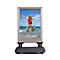 Advertising board with woman jumping at the beach. Metal stand, plastic base.