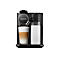 Schwarze Nespresso Kaffeemaschine mit Glas Latte Macchiato und Milchbehälter, Logo.