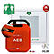 Roter AED-Defibrillator mit Griff und Aufschrift "AED". Daneben Piktogramme, darunter Herz-Symbol und "HLW".