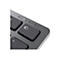 Gros plan sur un clavier d'ordinateur avec les touches 1, 2 et 3 pour les connexions et Bluetooth. Le gris et le noir dominent.