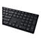 Schwarze Tastatur mit weißen Beschriftungen. Fokus auf den Ziffernblock und die Navigationstasten.