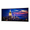 Breiter Dell Monitor mit dünnem Rand, der ein nächtliches New York Skyline-Panorama zeigt.