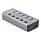 Silberner Delock USB-Hub mit fünf Anschlüssen, einzelnen Tasten und USB-C PD-Port vor weißem Hintergrund.