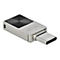 Silberner USB-C-Stick mit schwarzer, konzentrischer Oberflächenstruktur und 64-GB-Aufschrift auf weißem Grund.