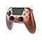 Kupferfarbener Gaming-Controller mit schwarzem Touchpad und zwei Joysticks vor weißem Hintergrund.