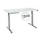 Height-adjustable desk with white tabletop and silver legs. Detail: Cable management.