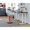 Desk with laptop and red stool, stands in front of window with light walls, on gray carpet.