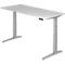 A gray height-adjustable desk. The tabletop is light gray, and the legs and frame are silver gray.