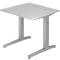 A gray height-adjustable desk against a white background. The tabletop is rectangular, the legs are sturdy and modern.