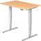 A height-adjustable desk with a light brown table top and silver legs. There is a control panel on the table top.