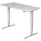 A white, height-adjustable desk with silver legs. A control unit can be seen on the table.