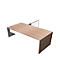 Wooden desk with white panel. Grey partition in the background.