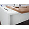 Close-up of a white desk with a brown wooden top. A cable is being fed into an opening.