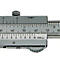 Close-up of a silver vernier caliper, with scale and numerals clearly visible.
