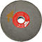 Disque de meulage gris avec étiquette rouge et flèche jaune.