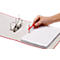 Red open binder with paper stack. Hand holding red tool for filing.