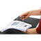 Person holding a binder with diagrams and a white holder. Red sleeve, black binder, white background.