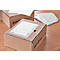 Two brown cardboard boxes with "Schäfer Shop" print and documents lie on a table.