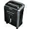 Black paper shredder with silver accents. Fellowes brand, paper shreds visible in the window. On wheels.